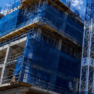 Scaffolding and safety mesh up the elevation
